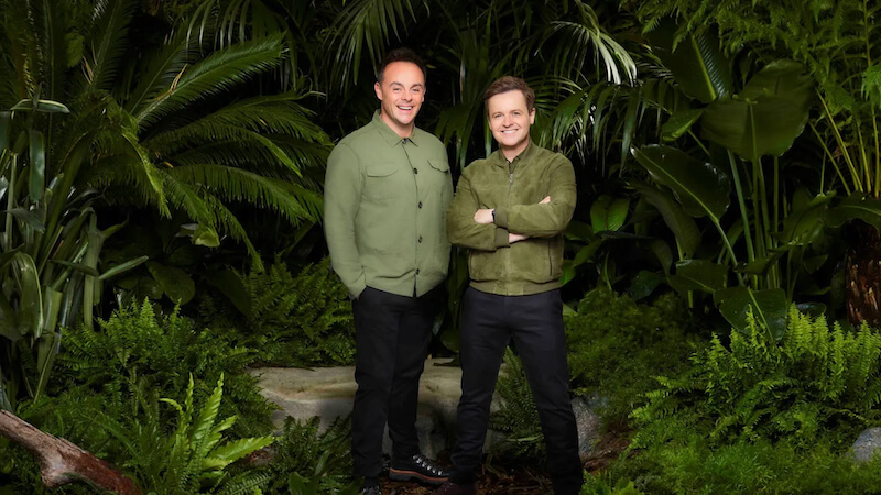 Ant and Dec stood in front of green jungle foliage
