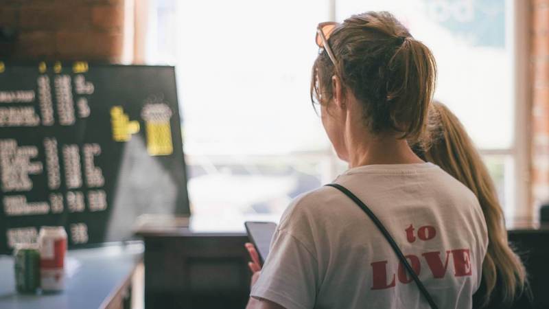 woman ordering food using phone
