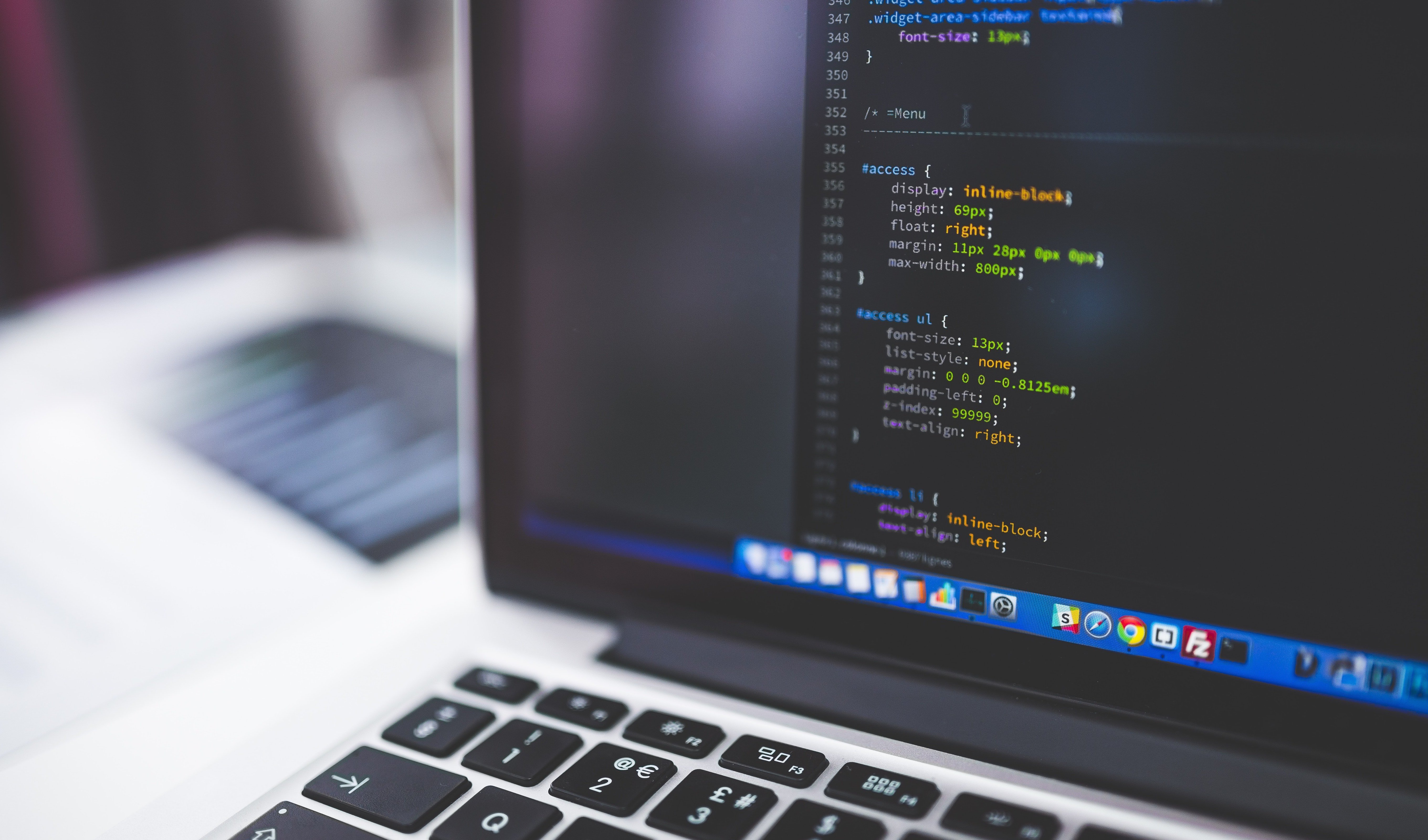 gray-laptop-computer-showing-html-codes-in-shallow-focus-160107 (1)-1