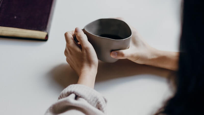 woman holding a cup of coffee